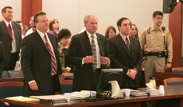 Defense attorneys David Chesnoff, left, and Scott Freeman stand with their client, Darren Mack, right, in Reno court on Oct. 24, 2007, during Mack's murder trial. Mack pleaded guilty to murdering ...