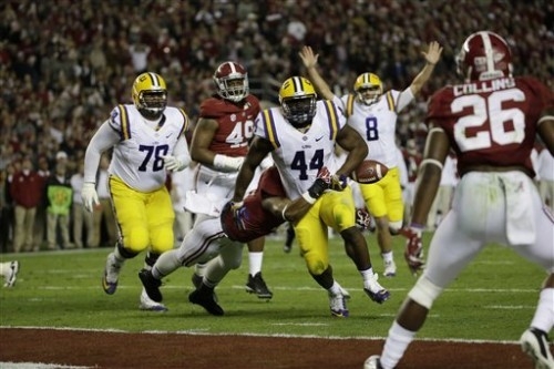 LSU fullback J.C. Copeland (44) has the ball stripped from him at the goal line by Alabama linebacker Tana Patrick (11) during the first half of an NCAA college football game, Saturday, Nov. 9, 20 ...