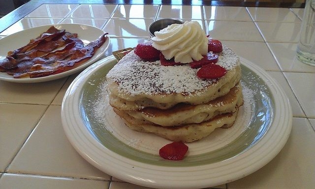 The Divine Pancakes at Divine Eatery feature whipped cream and strawberries. (Lisa Valentine/View)