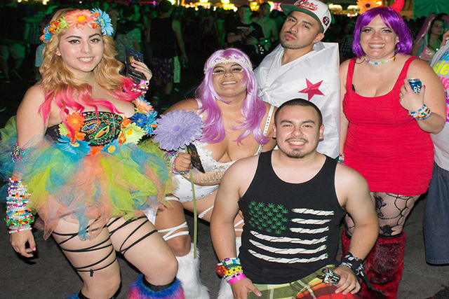 A group shows off their costumes at the Electric Daisy Carnival on Friday, June 20. (Kristen DeSilva/Las Vegas Review-Journal)