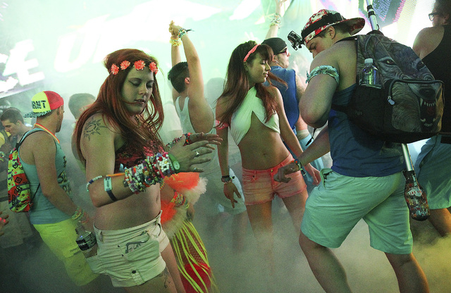 Attendees dance as Tommie Sunshine performs at Stage 7 at the Electric Daisy Carnival at the Las Vegas Motor Speedway in Las Vegas on Friday, June 20, 2014. (Chase Stevens/Las Vegas Review-Journal)