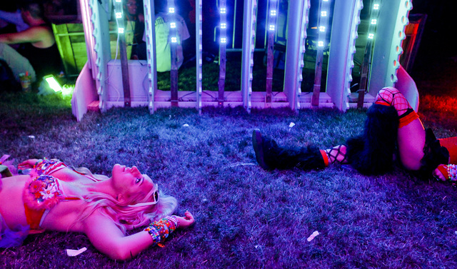 Tia Brandt of Los Angeles, Calif. watches the lights of an art installation at the Electric Daisy Carnival at the Las Vegas Motor Speedway in Las Vegas on Friday, June 20, 2014. (Chase Stevens/Las ...