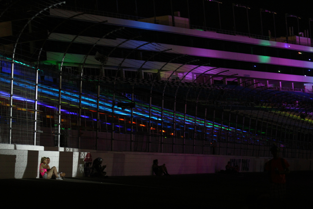 Attendees take a break as strobe lights flash from a nearby stage at the Electric Daisy Carnival at the Las Vegas Motor Speedway in Las Vegas on Friday, June 20, 2014. (Chase Stevens/Las Vegas Rev ...