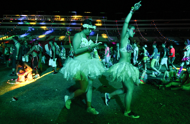 Attendees walk by the Cosmic Meadow stage as Destructo performs at the Electric Daisy Carnival at the Las Vegas Motor Speedway in Las Vegas on Saturday, June 21, 2014. (Chase Stevens/Las Vegas Rev ...
