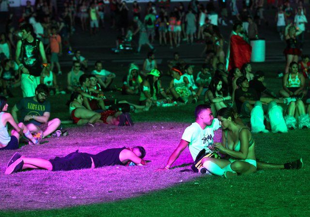 Attendees relax by the Cosmic Meadow stage at the Electric Daisy Carnival at the Las Vegas Motor Speedway in Las Vegas on Saturday, June 21, 2014. (Chase Stevens/Las Vegas Review-Journal)