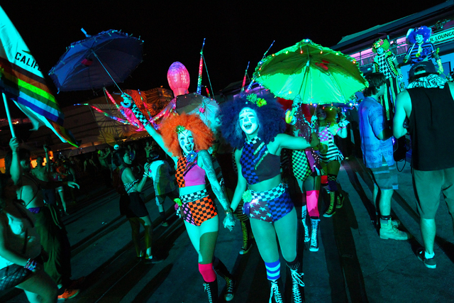 Costumed performers walk around at the Electric Daisy Carnival at the Las Vegas Motor Speedway in Las Vegas on Saturday, June 21, 2014. (Chase Stevens/Las Vegas Review-Journal)