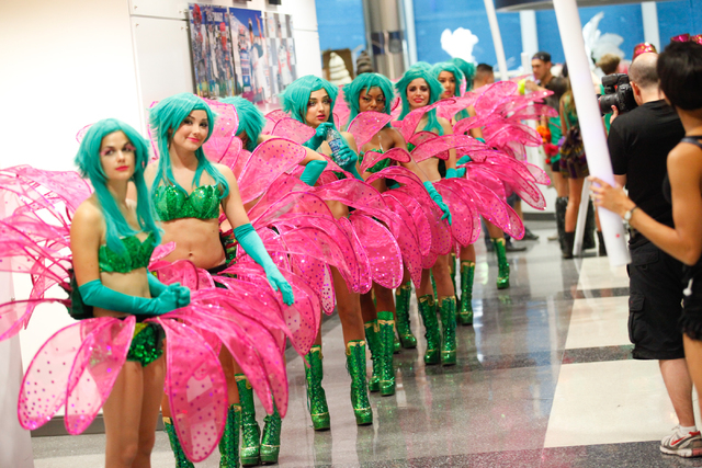 Costumed performers line up before heading out to mingle with the crowd at the Electric Daisy Carnival at the Las Vegas Motor Speedway in Las Vegas on Saturday, June 21, 2014. (Chase Stevens/Las V ...