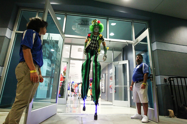 A costumed performer on stilts prepares to head out into the crowd at the Electric Daisy Carnival at the Las Vegas Motor Speedway in Las Vegas on Saturday, June 21, 2014. (Chase Stevens/Las Vegas  ...