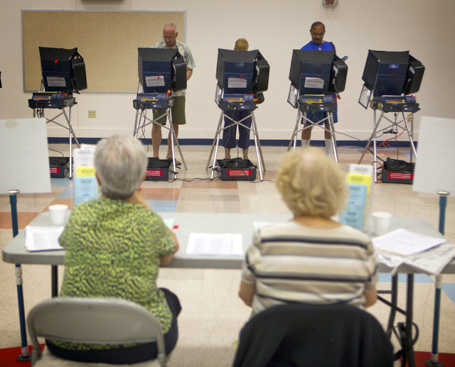 Voting as seen Tuesday, June 10, 2014 at D'Vorre & Hal Ober Elementary School at 3035 Desert Marigold Lane. Election officials are expecting a low turn out in today's primary election.(Jeff Scheid ...