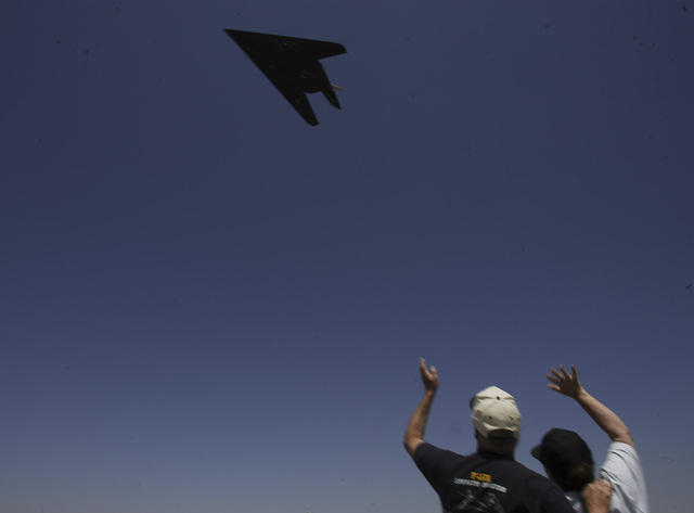 RJ FILE***
JEFF SCHEID/ REVIEW-JOURNAL
Phil and Bonnie Harris, from Landcaster, Cal, wave as a F-117A Nighthhawk stealth fighter takes off from the Lockheed Martin "Skunk Works" plant in ...