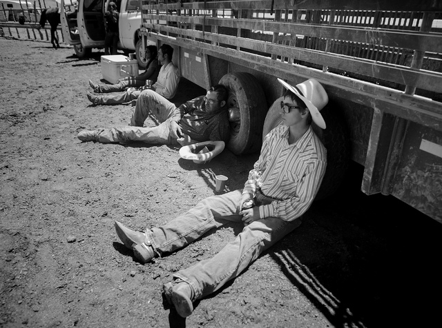 Erik Jackson, 19, right and Pook Hoots takes a break during calf branding at the Twin Creek Ranch, located around 200 miles north of Las Vegas as seen Wednesday, June 4, 2014. The Fallini family h ...