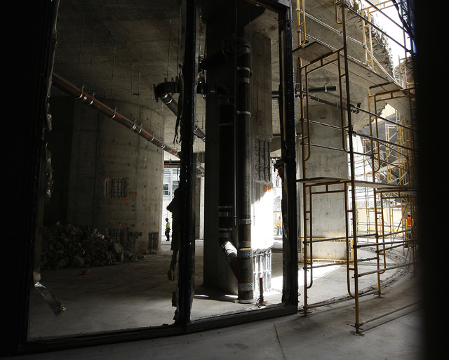 Workers are seen on the ground floor during the demolition of the Harmon Hotel at City Center in Las Vegas on Friday, June 20, 2014. (Jason Bean/Las Vegas Review-Journal)