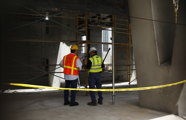 Workers are seen on the ground floor during the demolition of the Harmon Hotel at City Center in Las Vegas on Friday, June 20, 2014. (Jason Bean/Las Vegas Review-Journal)