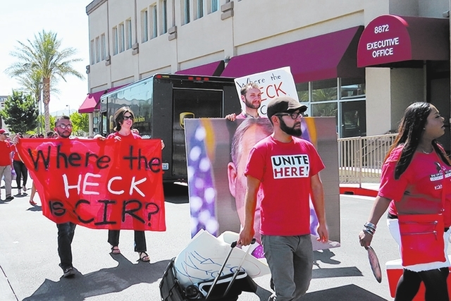 Pro-immigration reform activists protest outside U.S. Rep. Joe Heck’s office in Las Vegas on Wednesday. Five were cited by Las Vegas police for trespassing. (Courtesy/El Tiempo)