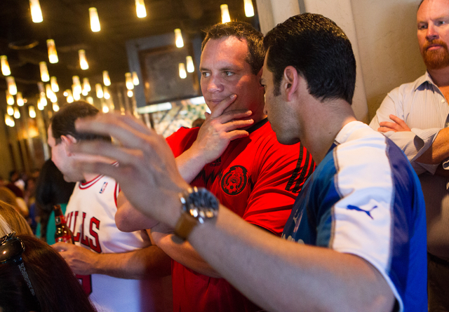 Secretary of State Ross Miller, center, talks with State Sen. Ruben Kihuen, D-Las Vegas, right, during Kihuen's "Soccer with the Senator" event for supporters featuring a watch party for ...