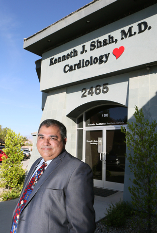 Dr. Kenneth Shah stands outside his practice, the Vascular Institute of Southern Nevada, Tuesday, May 13, 2014, in Henderson. Dr. Shah uses a low-risk laser atherectomy procedure to treat patients ...