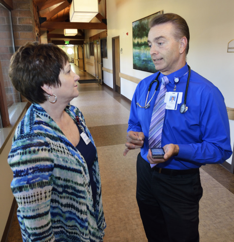 Dr. Michael Karagiozis, medical director for Nathan Adelson Hospice, right, talks with nurse Pamela Cate at the hospice at 4131 Swenson St. in Las Vegas on Friday, June 6, 2014. (Bill Hughes/Las V ...