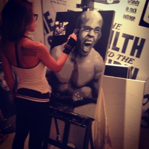 Octagon Girl Brittney Palmer, based in Los Angeles, works on her artwork that will be part of an art show that will be part of UFC's International Fight Week from July 1-6. (Courtesy UFC)