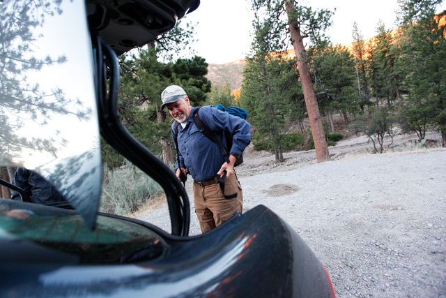 Fred Bell dons a backpack holding some of his sound recording equipment before hiking up Fletcher Canyon at Mount Charleston on Thursday, June 19, 2014. Bell goes to various areas to record the so ...