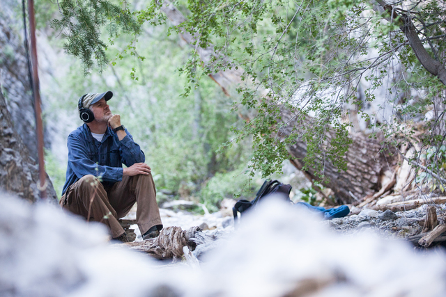 Fred Bell listens to the sounds of nature through his recording equipment in Fletcher Canyon at Mount Charleston on Thursday, June 19, 2014. Bell goes to various areas to record the sounds of natu ...