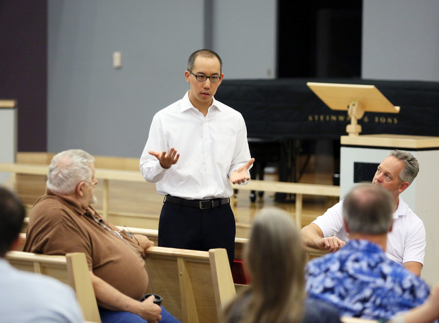 Robert Hoo leads a Nevadans for the Common Good meeting at Desert Springs United Methodist Church, located at 120 N. Pavilion Center Drive, Sunday, June 1, 2014, in Las Vegas. Nevadans for the Com ...