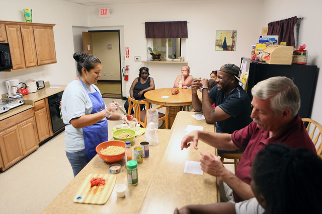 Marisa Cervantes (cq), left, Family Education Empowerment and Distribution program manager, prepares a whole wheat pasta salad during the Nutrition Education Class at the Lutheran Social Services  ...