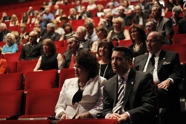 Nevada Governor Brian Sandoval and his wife Kathleen, front, attend the memorial service for the late Jim Rogers at Ham Concert Hall at UNLV in Las Vegas on Saturday, June 21, 2014. (Jason Bean/La ...