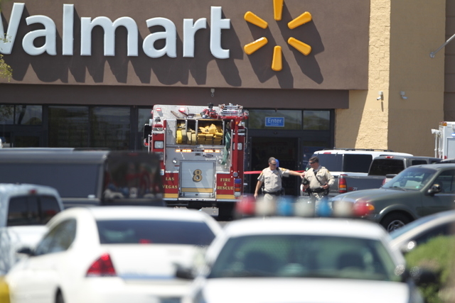 A bystander was shot and killed Sunday, June 8, 2014, at the Wal-Mart near Nellis Boulevard and Stewart Avenue by two people who had shot and killed two Metro police officers at a nearby pizza res ...