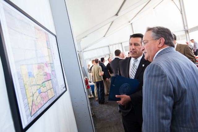 Las Vegas City Councilman Steve Ross, right, talks about the Skye Canyon master planned community with Gov. Brian Sandoval at the groundbreaking ceremony in northwest Las Vegas, near U.S. Highway  ...