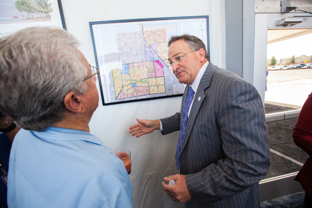 Las Vegas City Councilman Steve Ross, right, talks about the Skye Canyon master planned community with City Councilman Bob Coffin at the groundbreaking ceremony in northwest Las Vegas, near U.S. H ...