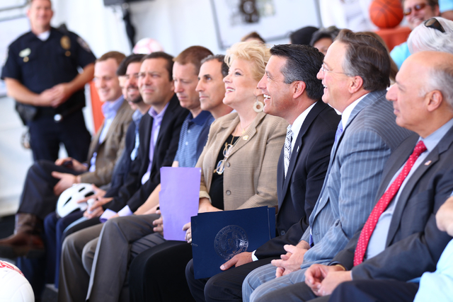 Public officials, including Las Vegas City Councilman Steve Ross, second from right, Gov. Brian Sandoval, third from right, and Las Vegas Mayor Carolyn Goodman, fourth from right, listen as Garry  ...