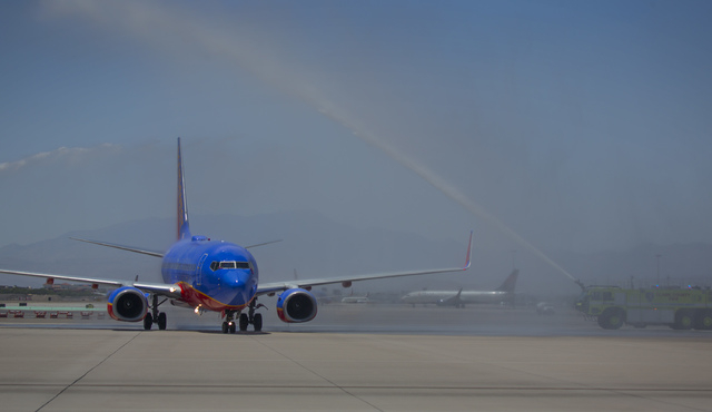 Southwest Airline  piloted by  Capt. Fred Sorenson gets a ceremonial retirement spraying  at  McCarran International Airport on Wednesday, June 11 , 2014.  Sorenson, known  ҊockӠin the ...
