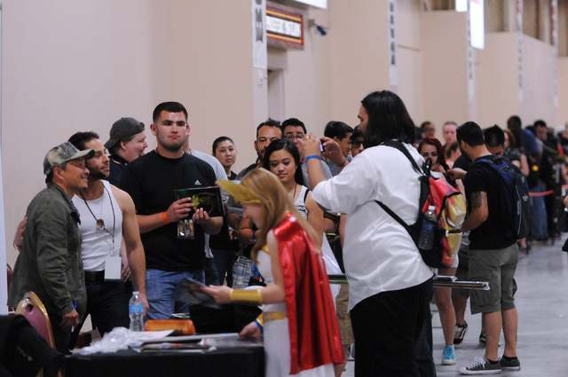 Fans wait line to meet comic book illustrator and publisher Jim Lee during the 2014 Amazing Las Vegas Comic Con at South Point casino-hotel in Las Vegas Saturday, June 21, 2014. (Erik Verduzco/Las ...