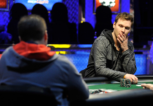 Brad Anderson, right, of Missoula, Mont., ponders his bet against Jonathan Dimmig, of Amherst, N.Y., during the final table of the Millionaire Maker event at the World Series of Poker tournament a ...