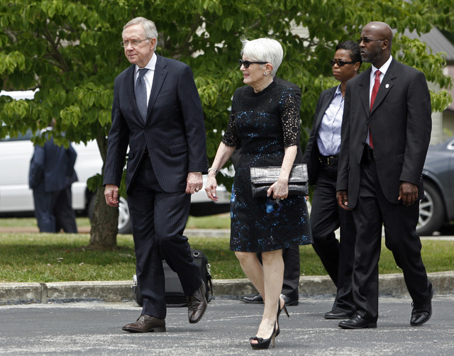 Senator Harry Reid and his wife, Landra Gould, arrive to attend the funeral of former Tennessee Senator Howard Baker, Jr. Tuesday, July 1, 2014, in Huntsville, Tenn. (AP Photo/Wade Payne)