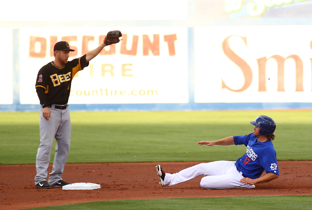 Las Vegas 51s' Matt den Dekker, right, slides safely into second base as Salt Lake Bees' Taylor Lindsey waits for the throw during a baseball game at Cashman Field in Las Vegas on Tuesday, July 1, ...