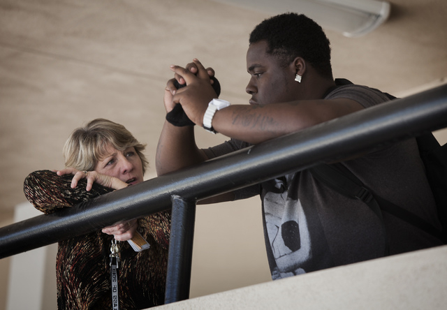 Chaparral High School transition counselor secretary Loretta Tucker talks to James "Bubba" Dukes in outside the school's administrative office on Thursday, April 10,2014. (Jeff Scheid/La ...