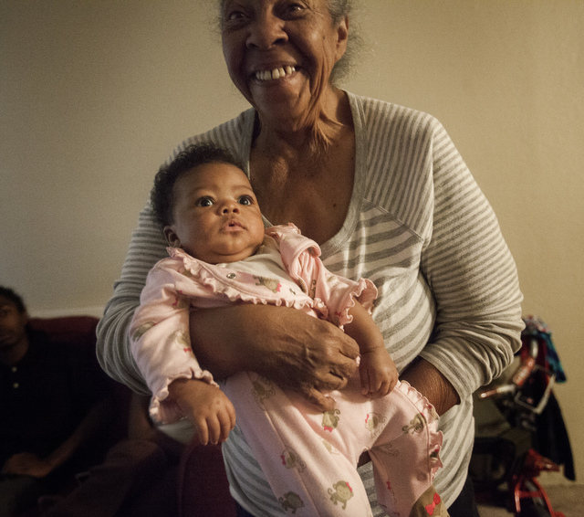 Margret Cole holds her two month old granddaughter Nehemiah Dukes on Tuesday,  Oct. 29, 2013. Cole is raising her daughter's children and her grandchild. (Jeff Scheid/Las Vegas Review-Journal)