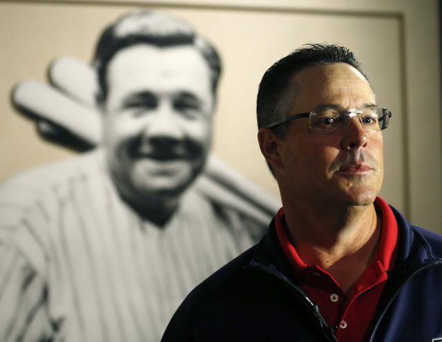 Former Atlanta Braves pitcher Greg Maddux visits a Babe Ruth exhibit during his orientation visit at the Baseball Hall of Fame on Monday, March 24, 2014, in Cooperstown, N.Y. Maddux will be induct ...