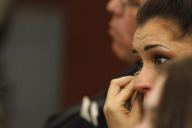 Celeste Flores Narvaez wipes a tear during the sentencing hearing of her sister's murderer Jason Griffith at the Regional Justice Center in Las Vegas Wednesday, July 23, 2014. Griffith was sentenc ...