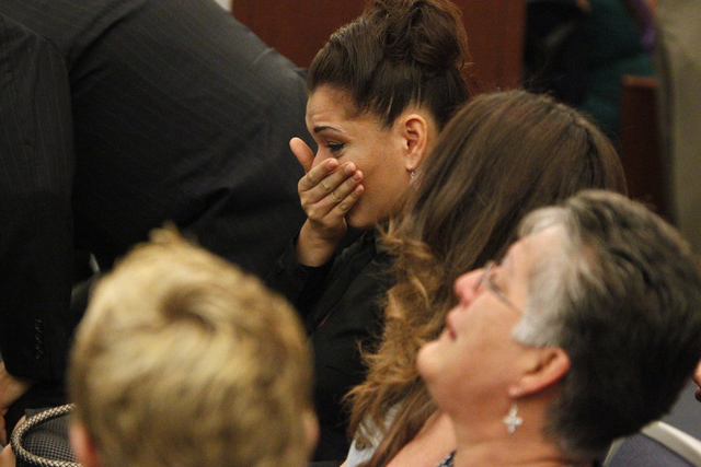 Celeste Flores Narvaez, center, reacts to sentencing of her sister's murderer Jason Griffith at the Regional Justice Center in Las Vegas Wednesday, July 23, 2014. Griffith was sentenced to 10 year ...