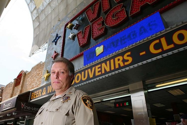 Metro Police Capt. Shawn Andersen, (cq) of Downtown Area Command that polices Fremont Street Experience, stands outside a gift shop that sells liquor at Fremont Street Experience Thursday, July 17 ...