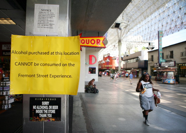 Signs are posted on the entrance to a gift shop that sells liquor at Fremont Street Experience Thursday, July 17, 2014, in Las Vegas.  A series of liquor ordinances are in effect regulating alcoho ...