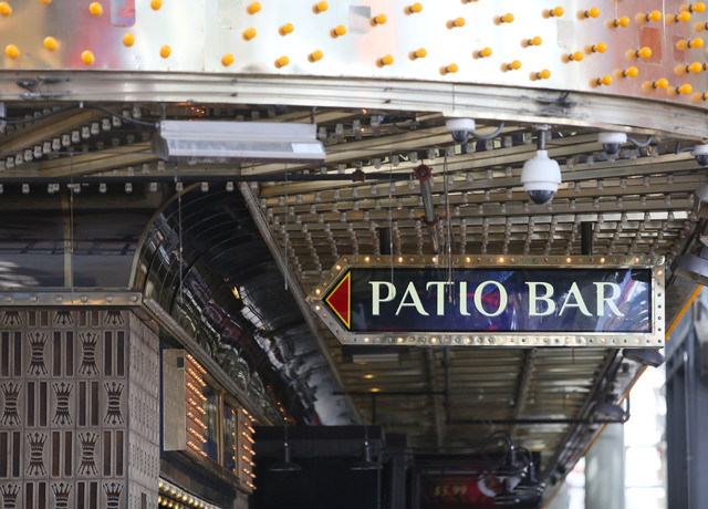 A sign advertises a patio bar at the Four Queens on Fremont Street Experience Thursday, July 17, 2014, in Las Vegas.  A series of liquor ordinances are in effect regulating alcohol carrying and co ...