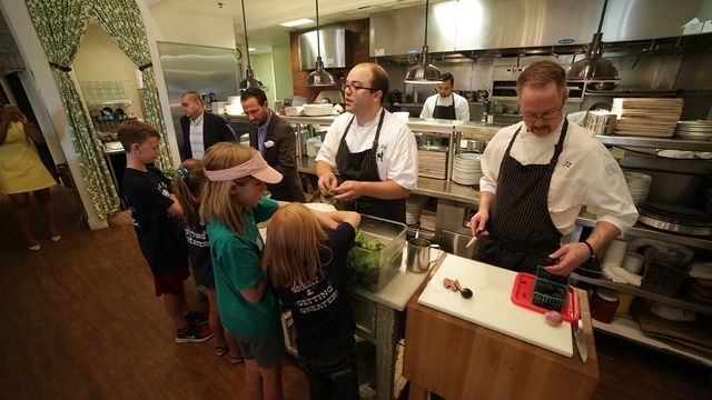 Honey Salt chefs Brett Uniss and Joe Zanelli used green beans, lettuce, figs and other raw vegetables from student gardens throughout the Las Vegas Valley during a June 30 demonstration at the res ...