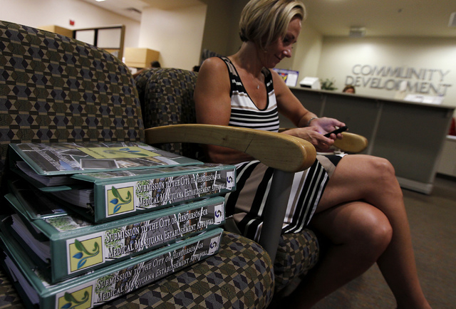 Debra Freeman waits her turn to apply for a medical marijuana establishment in the Community Development office at Henderson City Hall on July 17, 2014. (Jason Bean/Las Vegas Review-Journal)