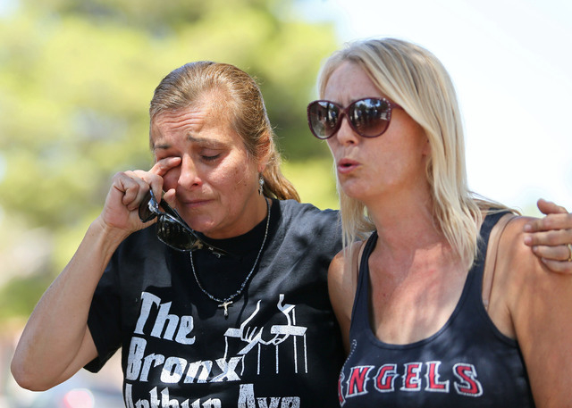 Julie Ramos, left, stands with her sister Kim Johnston outside Ramos’ home during a news conference on Autumn Street Wednesday, July 30, 2104, in Las Vegas. The Ramos family called a news c ...