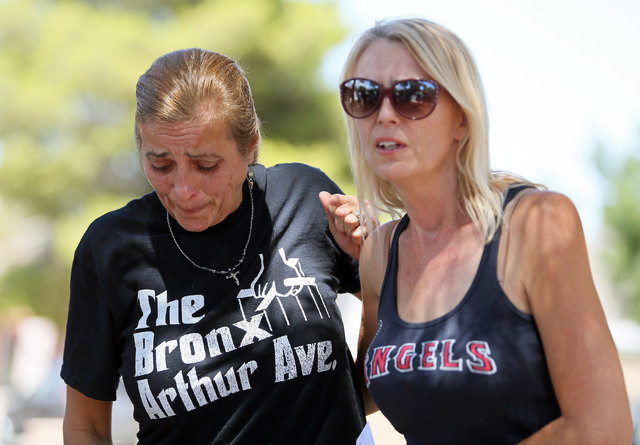 Julie Ramos, left, stands with her sister Kim Johnston outside Ramos’ home during a news conference on Autumn Street Wednesday, July 30, 2104, in Las Vegas. The Ramos family called a news c ...