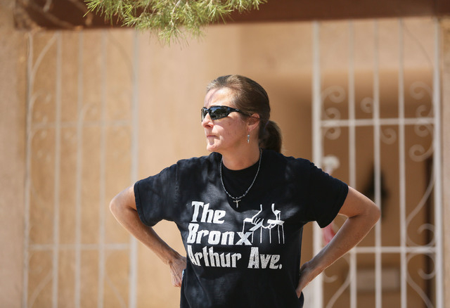 Julie Ramos looks off while standing in front of her home prior to speaking during a news conference on Autumn Street Wednesday, July 30, 2104, in Las Vegas. The Ramos family called a news confere ...
