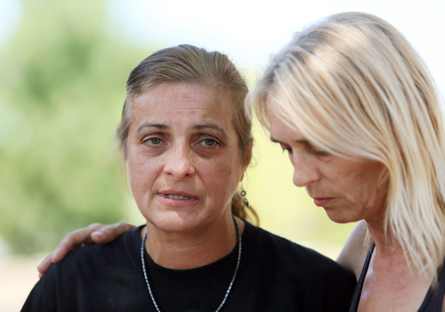 Julie Ramos, left, stands next to her sister Kim Johnston outside Ramos’ home and speaks during a news conference on Autumn Street Wednesday, July 30, 2104, in Las Vegas. The Ramos family c ...